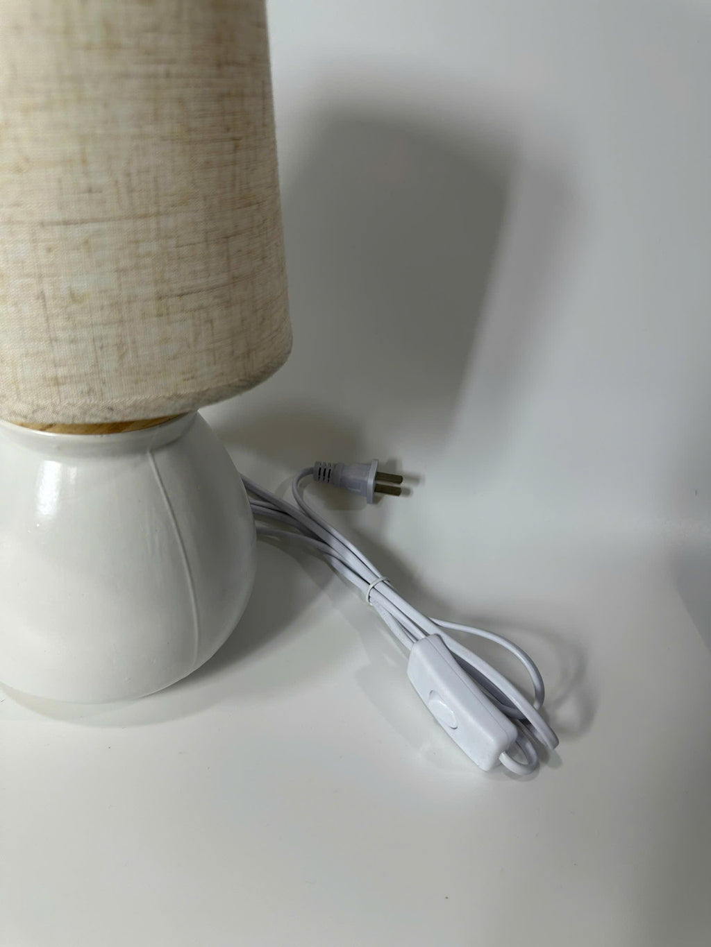 Handmade ceramic table lamp with warm ambient light. Simple form, gentle glow, timeless mood.