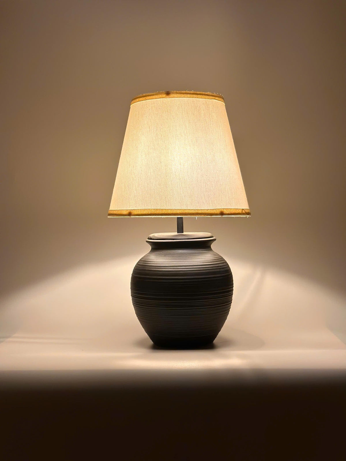 Handmade ceramic table lamp with warm ambient light. Simple form, gentle glow, timeless mood. Bat Trang ceramic, Vietnam.