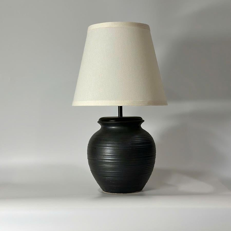Handmade ceramic table lamp with warm ambient light. Simple form, gentle glow, timeless mood. Bat Trang ceramic, Vietnam.