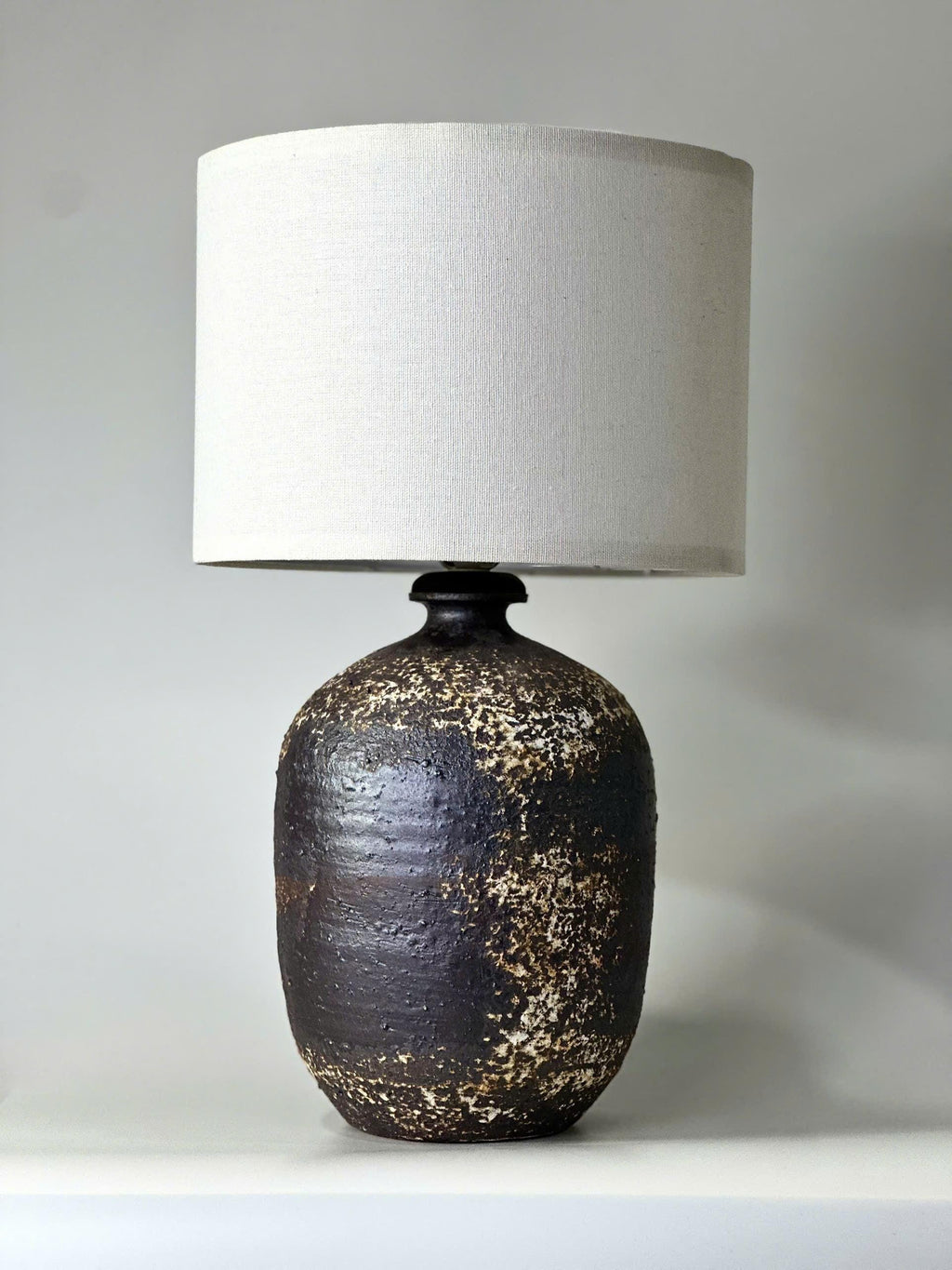 Handcrafted Ceramic Lamp, Ancient Cylindrical Form, Textured Glaze, Linen Shade, Wabi-Sabi Glow