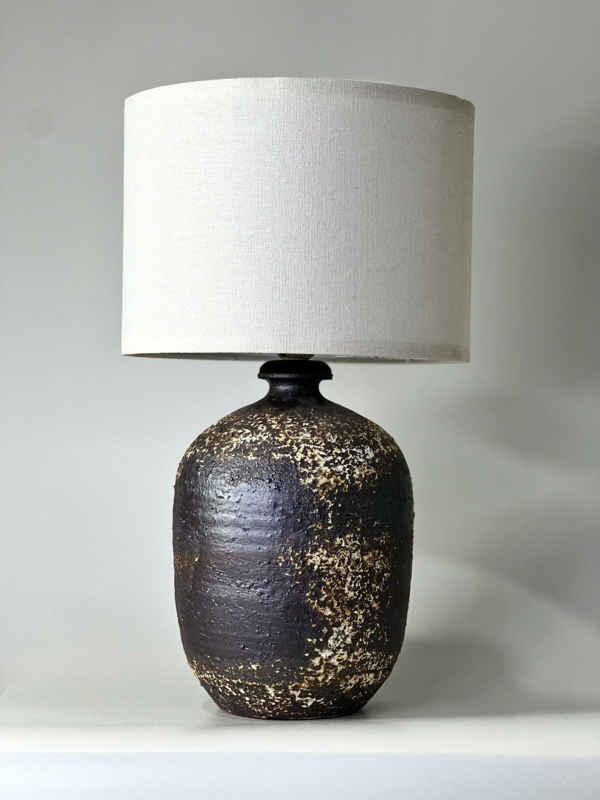 Handcrafted Ceramic Lamp, Ancient Cylindrical Form, Textured Glaze, Linen Shade, Wabi-Sabi Glow