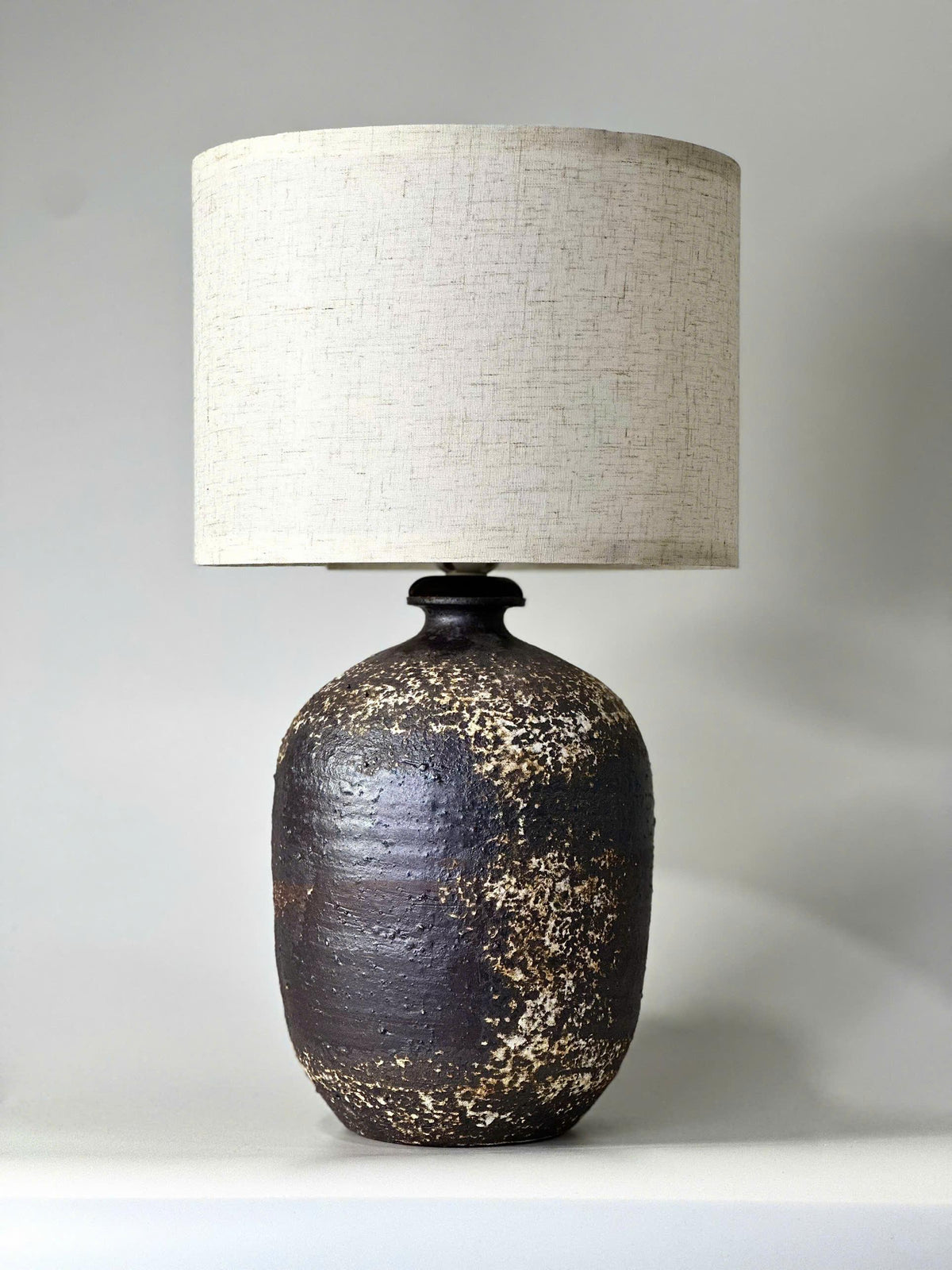 Handcrafted Ceramic Lamp, Ancient Cylindrical Form, Textured Glaze, Linen Shade, Wabi-Sabi Glow