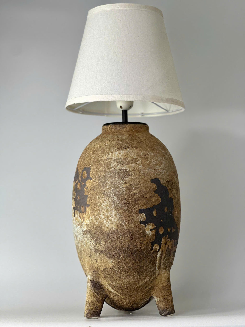 Elevate your home with this handmade ceramic lamp, featuring organic textures, warm tones, and a timeless artisan finish.