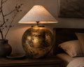Handmade ceramic table lamp with a vintage gold finish—bringing warm, timeless elegance to any cozy interior.