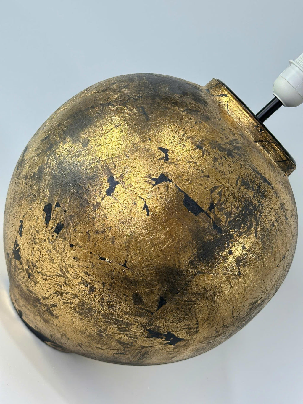Handmade ceramic table lamp with a vintage gold finish—bringing warm, timeless elegance to any cozy interior.