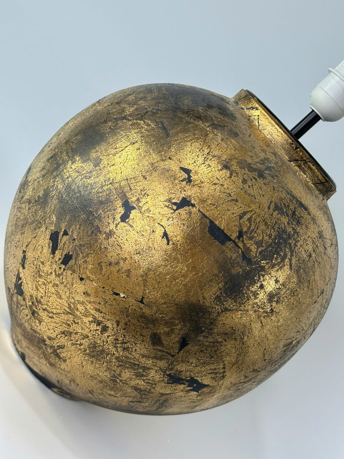Handmade ceramic table lamp with a vintage gold finish—bringing warm, timeless elegance to any cozy interior.