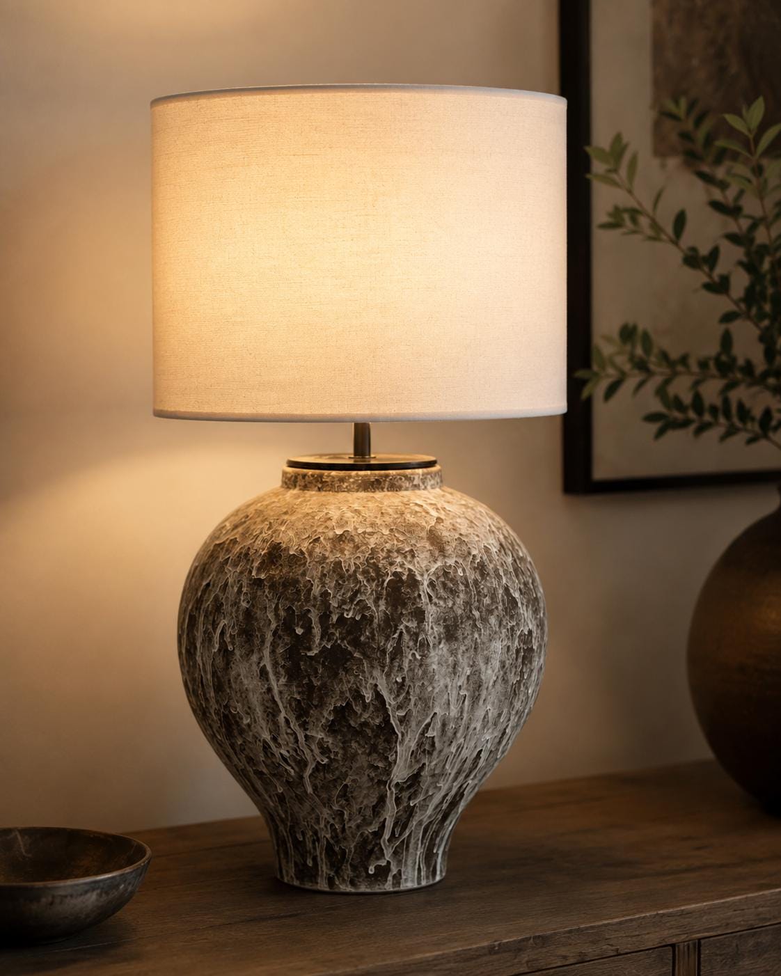 Handcrafted ceramic table lamp with an aged earthy finish, bringing warm wabi-sabi charm and timeless elegance to any space.