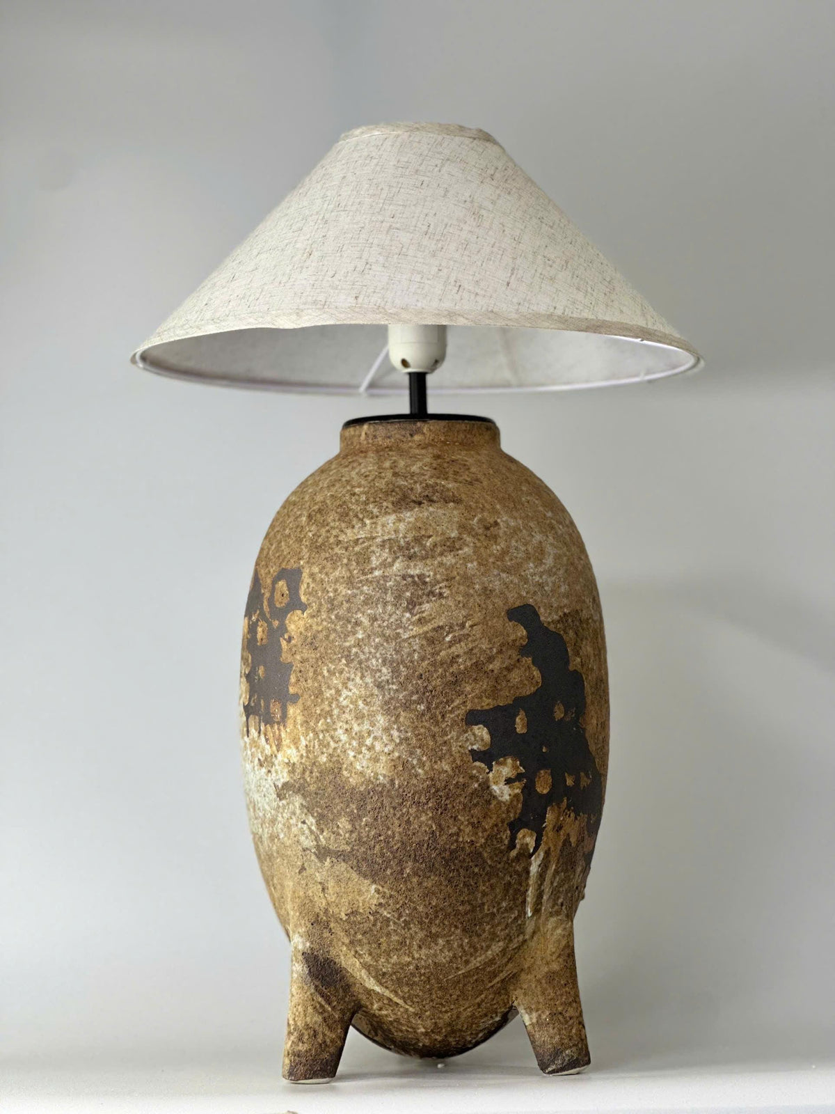 Elevate your home with this handmade ceramic lamp, featuring organic textures, warm tones, and a timeless artisan finish.