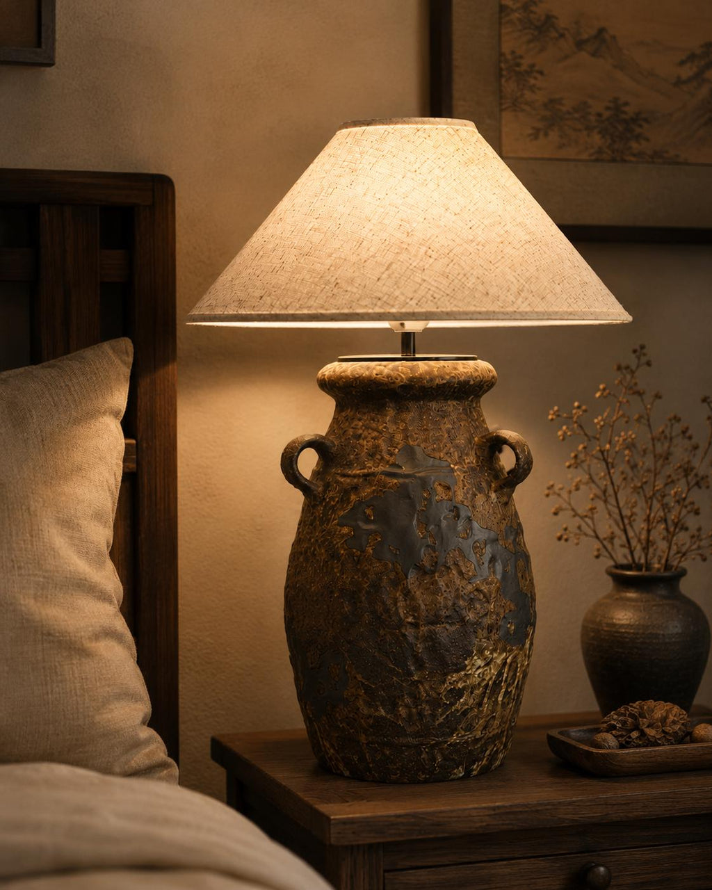 Handcrafted ceramic table lamp with rustic earthy textures, creating a warm, cozy glow for wabi-sabi, Japandi, and modern homes.